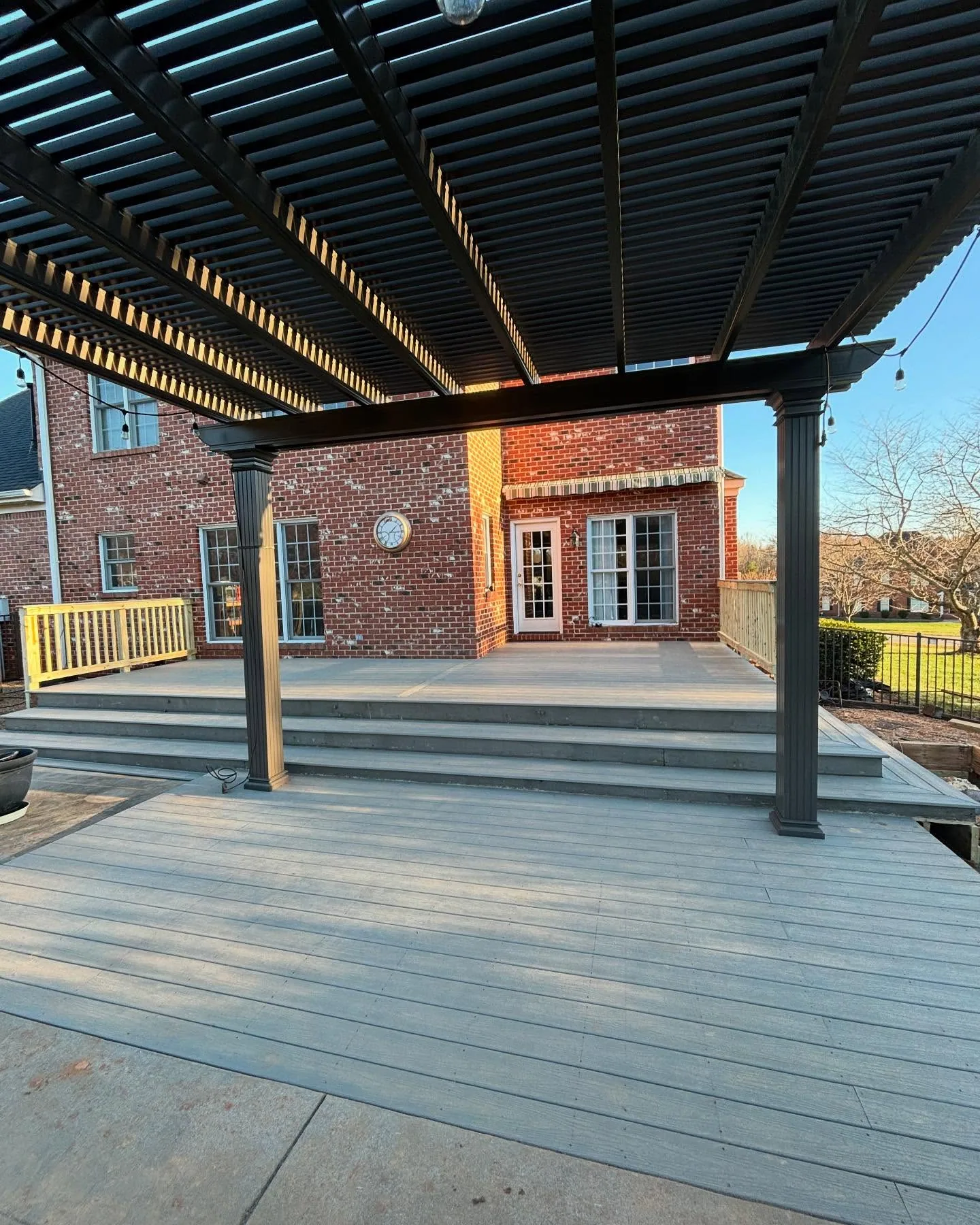 Black aluminum pergola gray composite deck